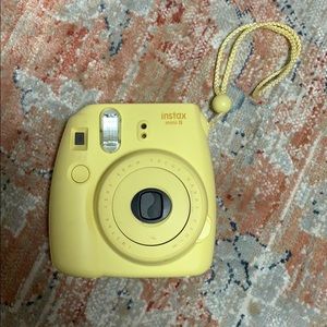 Yellow instax mini 8 polaroid camera
